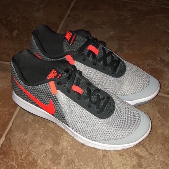 grey nike shoes with orange swoosh